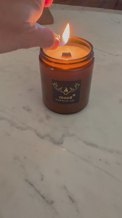 lighting a wood wick candle
