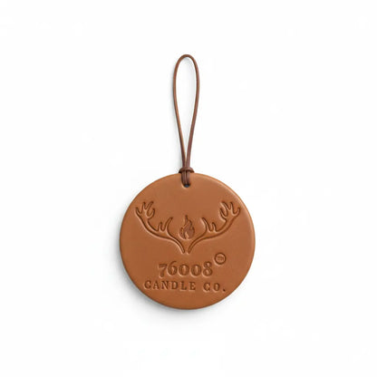 Studio product photo of leather air freshener tag